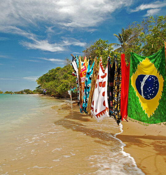 Ana Če Photography - Beach with colorful flags hanging from a line, creating a vibrant and festive atmosphere.